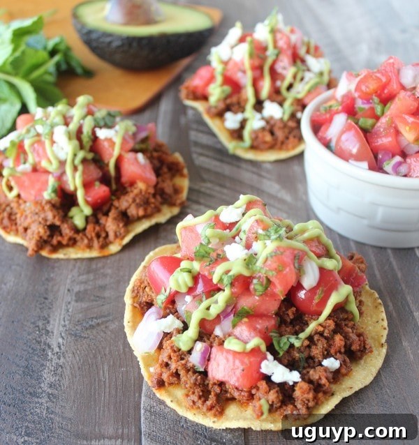 Chorizo Tostadas with a generous topping of Serrano Watermelon Salsa and avocado cream.