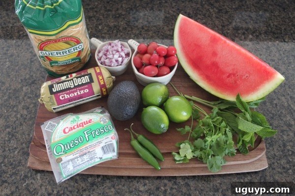 Ingredients for Chorizo Tostadas with Watermelon Serrano Salsa laid out on a cutting board.