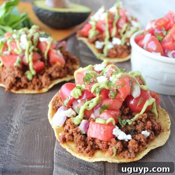 A beautifully plated Chorizo Tostada with Watermelon Serrano Salsa, ready to be enjoyed.