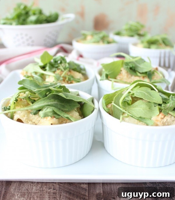 Finished Chicken Caesar Baked Pasta Cups with arugula garnish