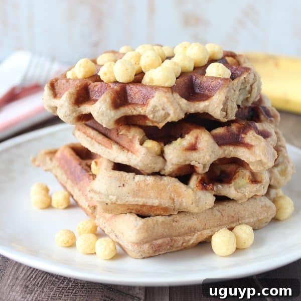 Crispy Peanut Butter Banana Gluten Free Waffles - Golden brown waffles with a crispy exterior, topped with a drizzle of honey.