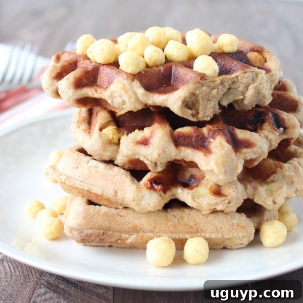 Gluten Free Peanut Butter Banana Waffles - Close-up of a single waffle showing the crispy texture and cereal pieces.