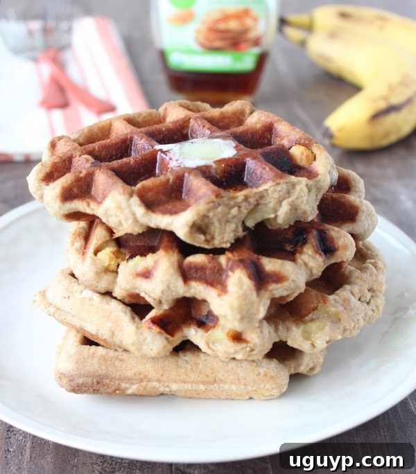 Crispy Peanut Butter Banana Gluten Free Waffles Recipe - Waffle cooking in a waffle iron.