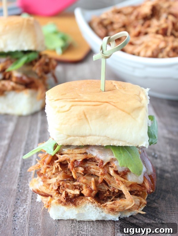 A beautifully styled shot of Slow Cooked Chipotle Maple Shredded Chicken Sliders on a platter, ready for a feast.