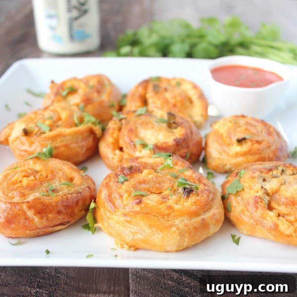 Close-up of baked Buffalo Cheesy Puff Pastry Rolls
