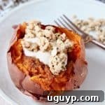 Roasted sweet potato stuffed with yogurt and granola, close-up