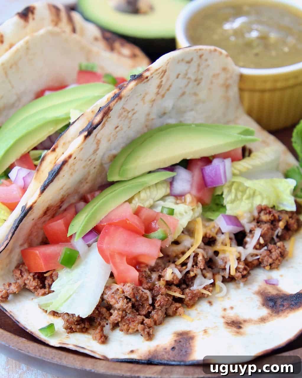 Ground beef tacos with avocado and tomatoes
