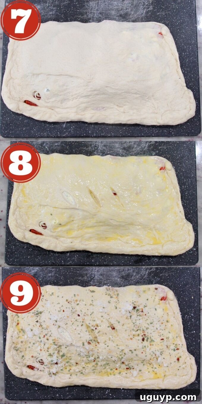 Further steps in making a homemade calzone, including brushing with egg wash, making slits in the dough, and preparing for baking.