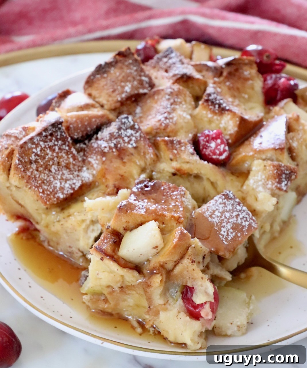 piece of french toast bake on a plate with a fork