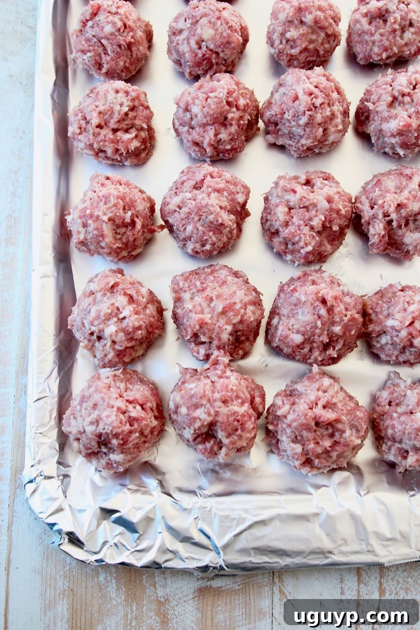 Chinese pork meatballs on foil lined baking sheet