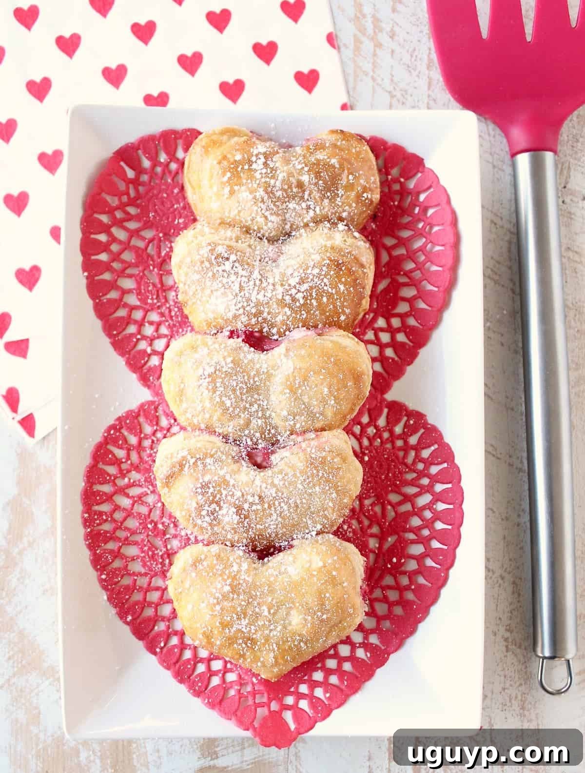 Assortment of Heart Shaped Strawberry Cheesecake Puff Pastry Pies