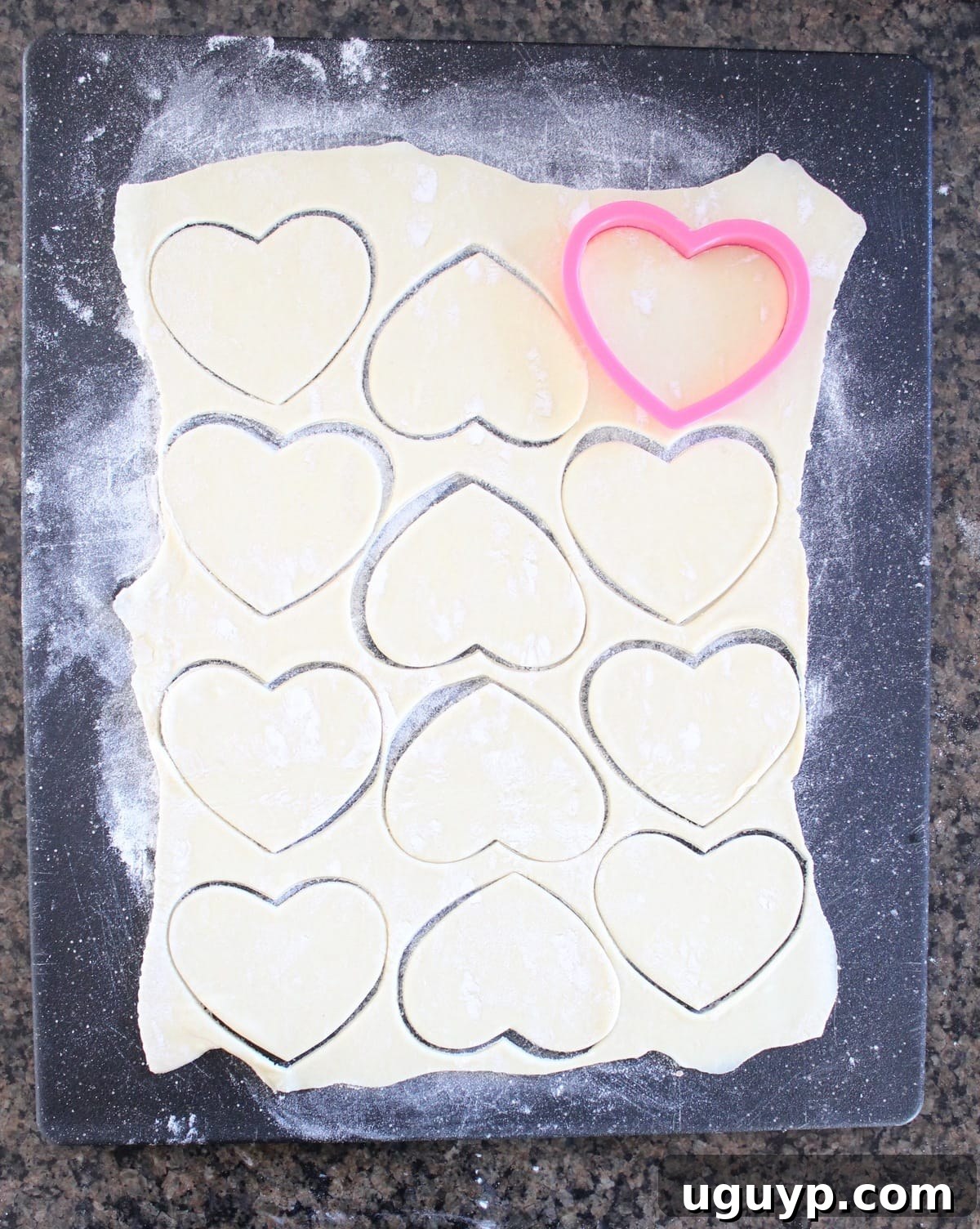 Puff pastry dough rolled out and heart shapes cut with a cookie cutter