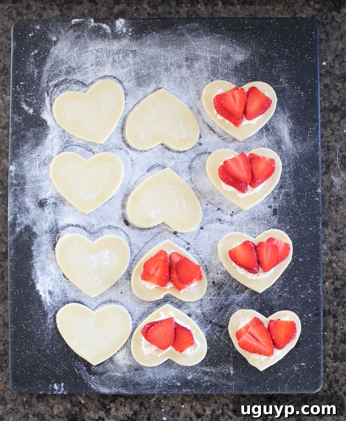 Adding strawberry mixture on top of the cream cheese filling