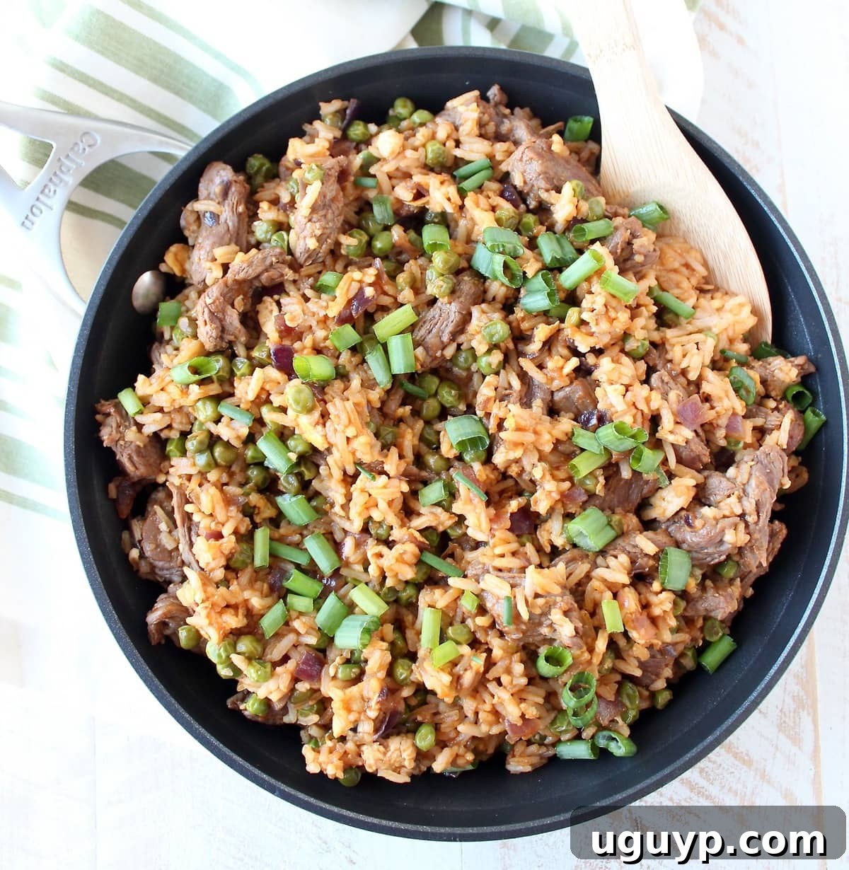 Sriracha Steak Fried Rice plated and ready to serve, garnished with green onions