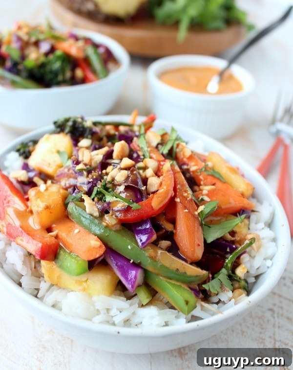 Colorful Thai Peanut Pineapple Veggie Rice Bowl with fresh ingredients