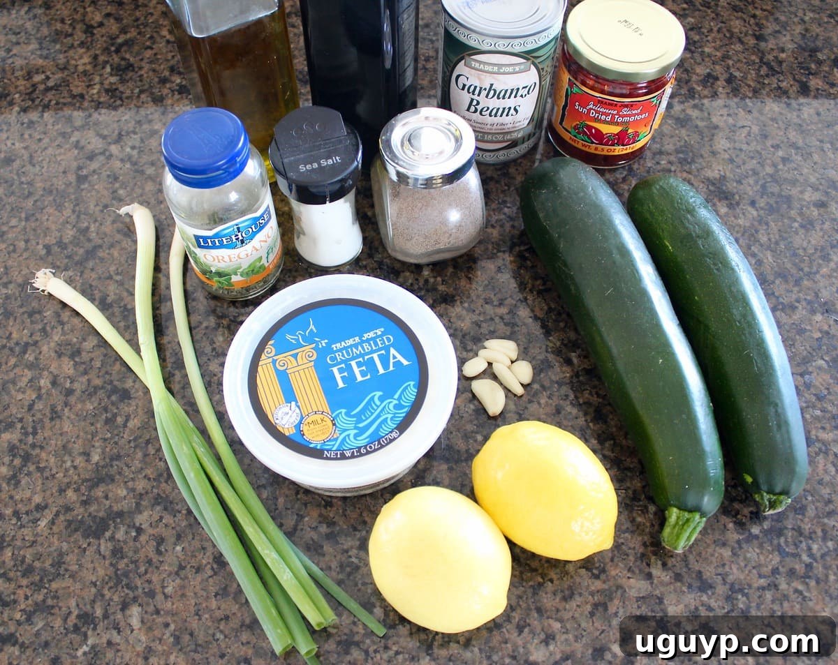 Greek Zucchini Noodles Ingredients on a granite countertop