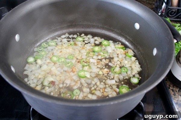 Sautéing onions and garlic with white wine for shrimp scampi