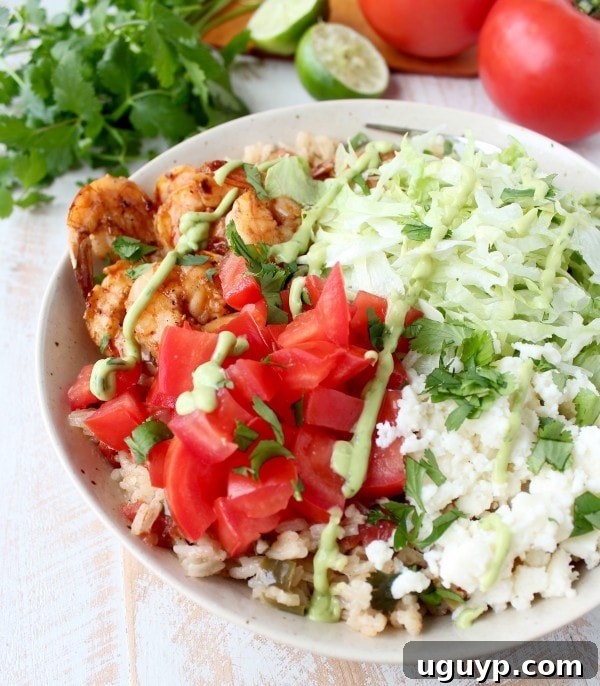Close-up of vibrant Chili Lime Shrimp and Rice Taco Salad, showing fresh ingredients and rich colors.
