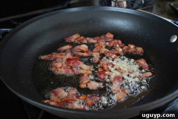 Cooking bacon and garlic for One Pot Pasta Carbonara