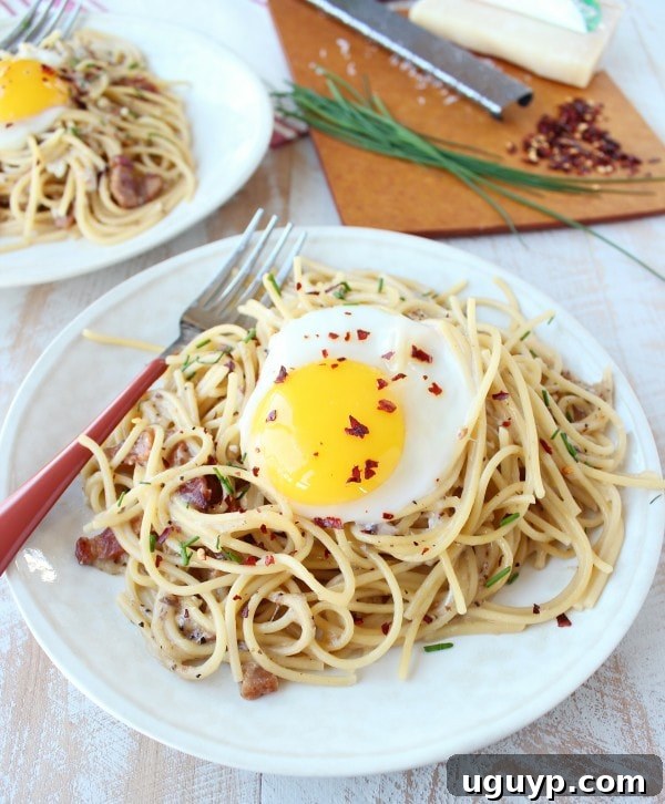 One Pot Pasta Carbonara served with a raw egg on top