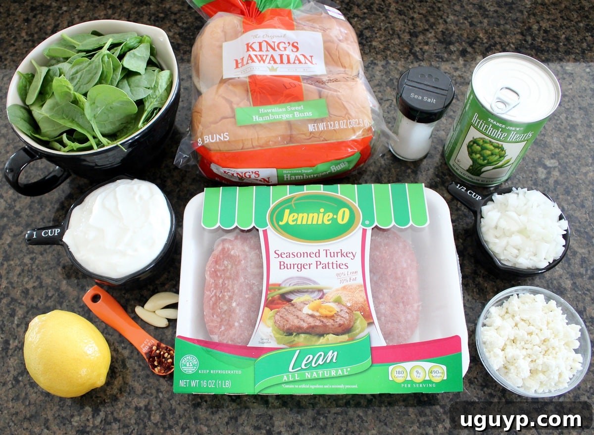 Close-up of two Spinach Artichoke Turkey Burgers on toasted buns