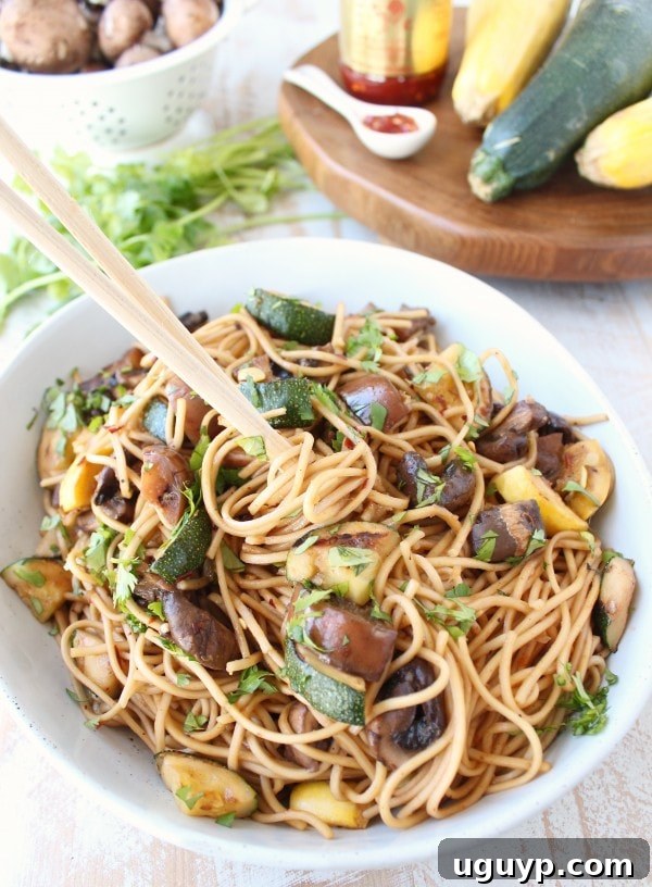 Bowl of freshly cooked Lo Mein noodles tossed with the rich Asian sauce