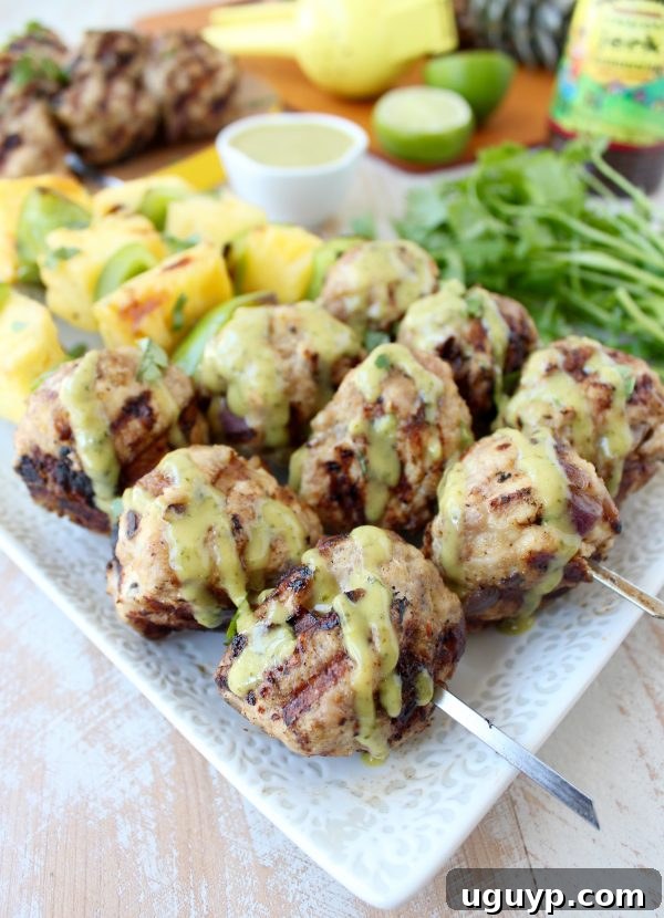 Honey Lime Dressing Drizzled Over Jerk Meatballs and Grilled Fruit