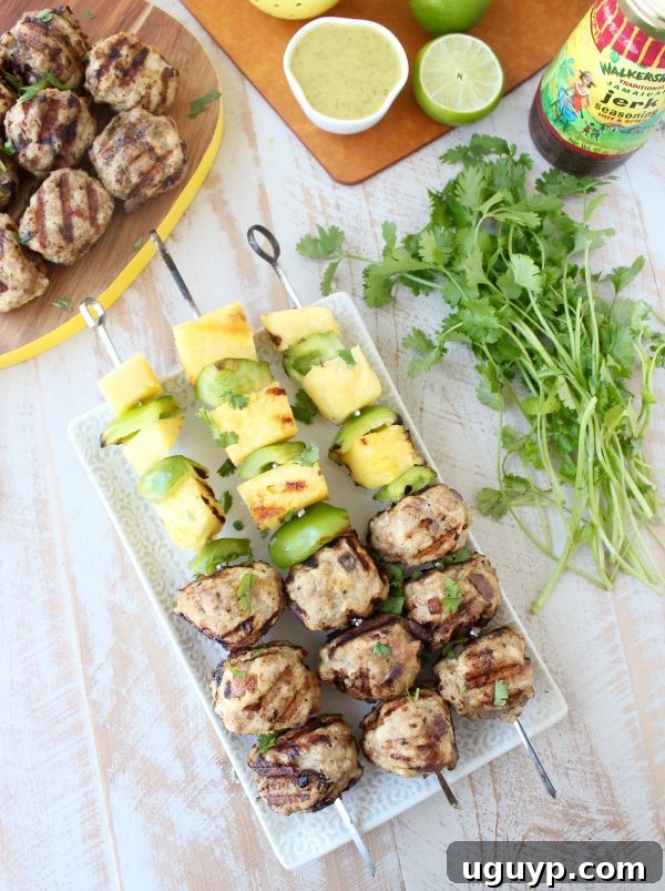 Jerk Chicken and Pork Meatball Skewers with Grilled Pineapple and Bell Peppers