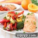 An easy Chinese orange sauce is prepared & brushed over Orange Glazed Salmon and colorful vegetables in this healthy, simple, 30 minute foil dinner recipe!