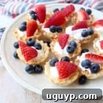 Finished Berry Cream Fillo Baskets garnished with fresh berries.