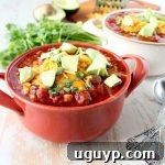 A vibrant bowl of Slow Cooker Chorizo Corn Chili, garnished and ready to serve.