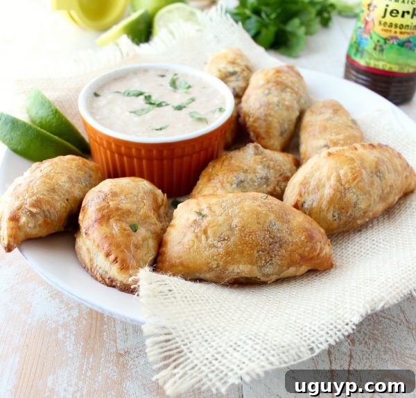 Golden-brown Jamaican Jerk Beef Patties, ready to be served as an appetizer.