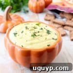 Close-up of the finished Jalapeno Pumpkin Dip in a small bowl.