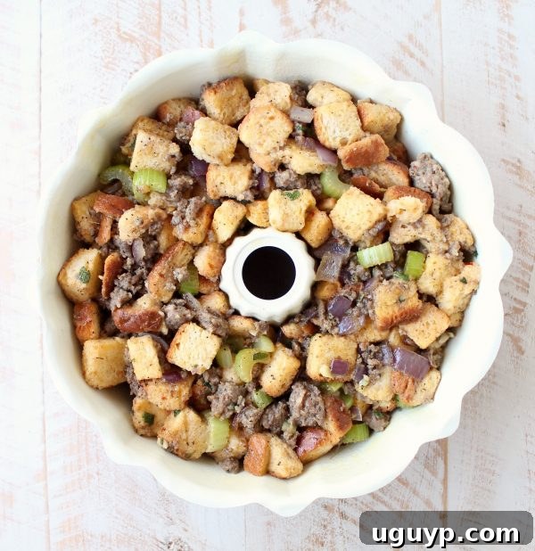 Uncooked sausage stuffing mixture pressed into a bundt pan