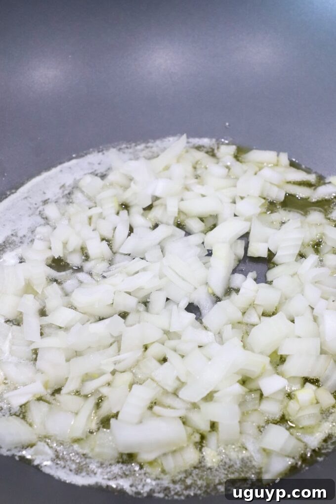 diced onions in melted butter in large skillet