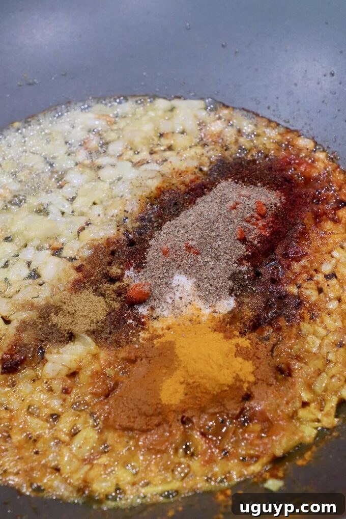 spices and diced onions in large skillet