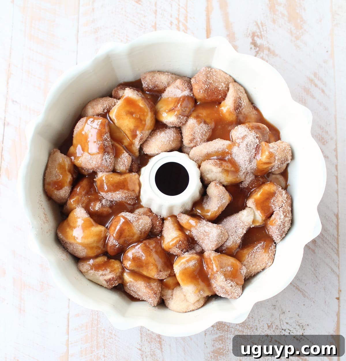 Cinnamon sugar biscuits layered over caramel and pecans in a bundt pan.