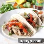 A delicious Jerk Chicken Fajita plate, showcasing the vibrant chicken and vegetables ready to be enjoyed.