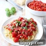 A close-up of a bowl of Roasted Red Pepper Turkey Bolognese, rich and inviting, ready to be served.