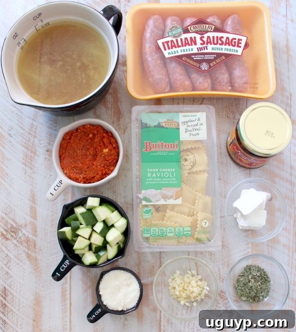 Overhead view of a large skillet filled with One Pot Ravioli, showcasing the creamy sauce and ingredients before serving.