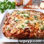 Buffalo sauce, ground beef, pork sausage and two cheeses are combined in this delicious, easy Buffalo Cheesy Meatloaf recipe!