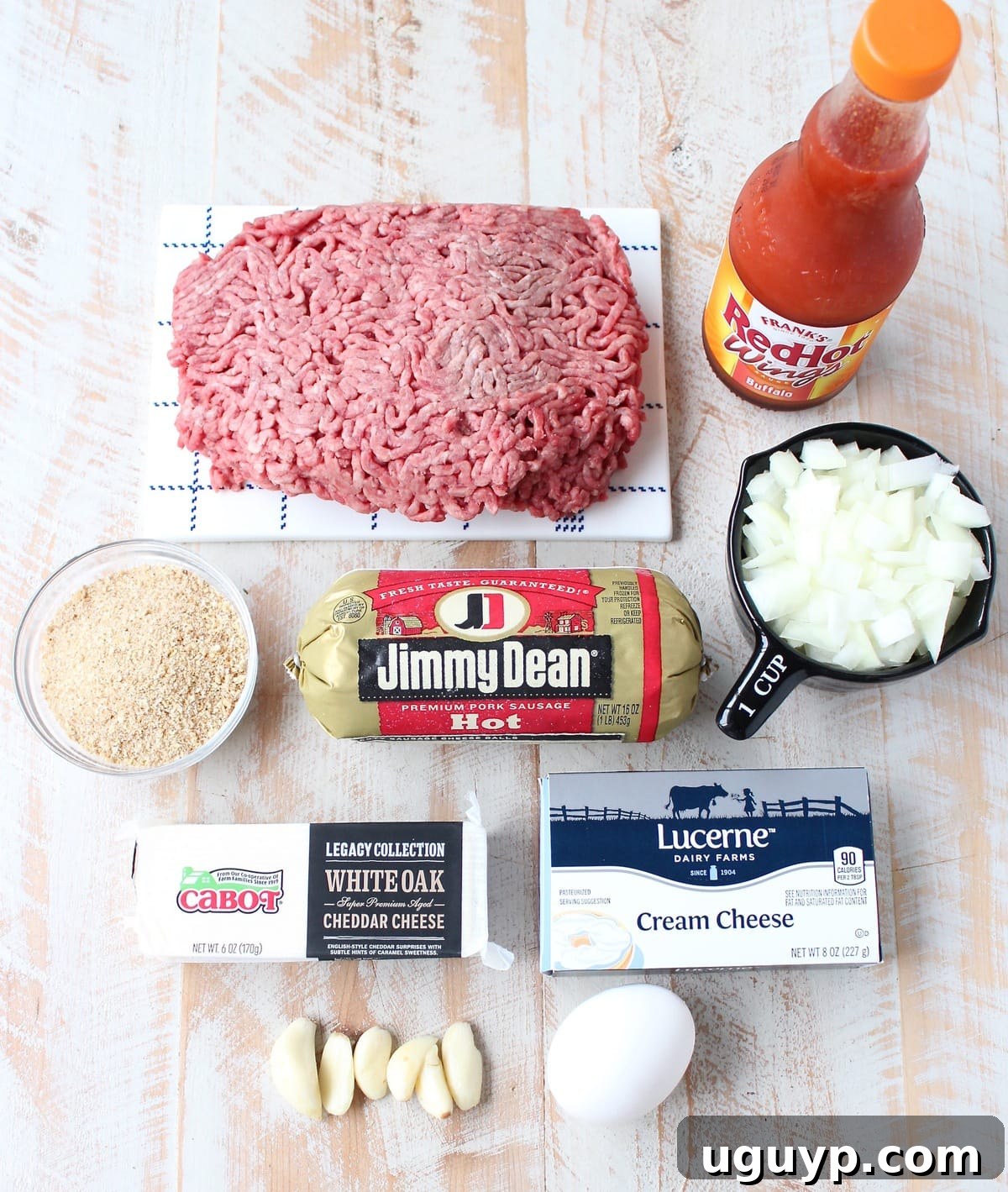 ingredients for buffalo cheesy meatloaf on white wood board
