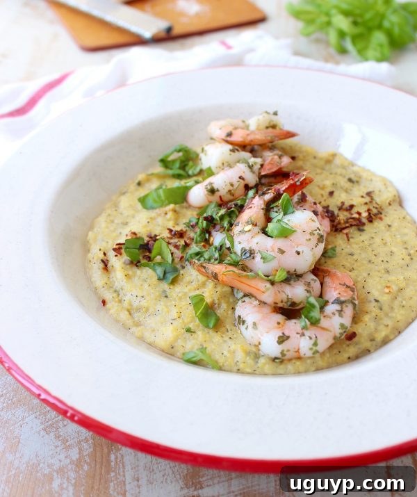 Overhead view of a prepared bowl of Italian shrimp and polenta, ready for a quick meal