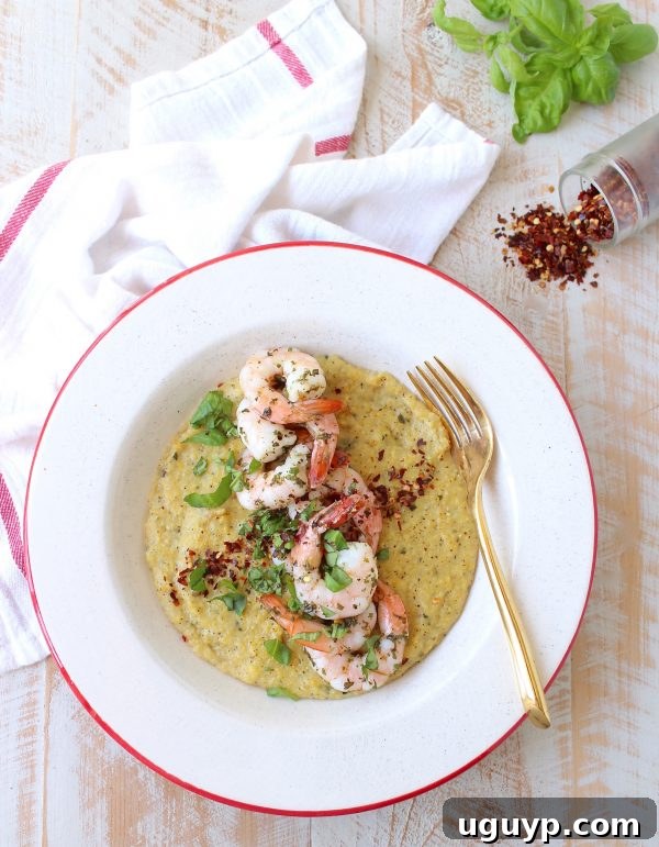 Close-up of creamy polenta with perfectly cooked Italian shrimp, ready to serve