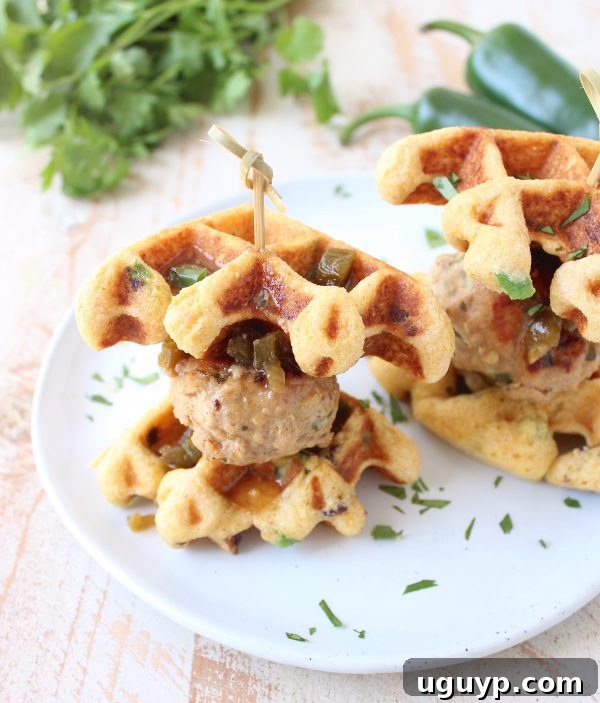 Jalapeño Honey Chicken & Pork Meatballs are sandwiched between Jalapeño Bacon Cornbread Waffles in this delicious recipe for Meatball Sliders, putting a new, fun twist on chicken & waffles!