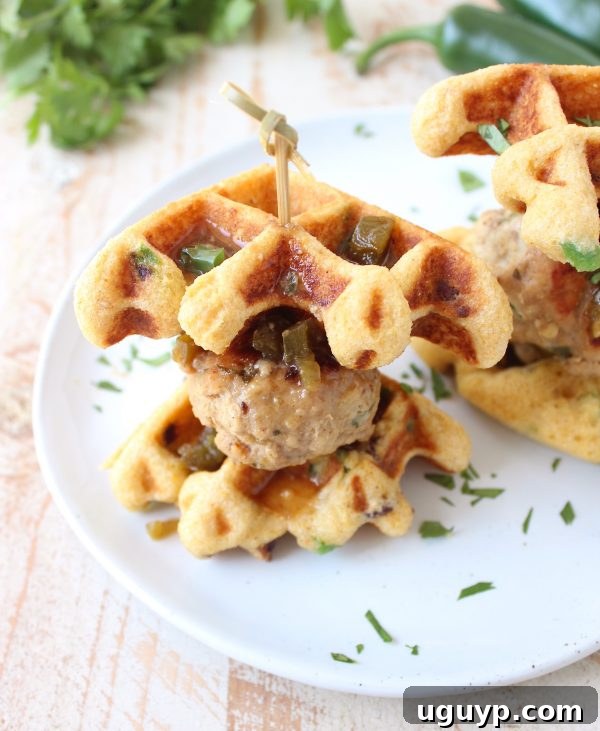 Jalapeño Honey Chicken & Pork Meatballs are sandwiched between Jalapeño Bacon Cornbread Waffles in this delicious recipe for Meatball Sliders, putting a new, fun twist on chicken & waffles!