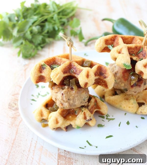 Jalapeño Honey Chicken & Pork Meatballs are sandwiched between Jalapeño Bacon Cornbread Waffles in this delicious recipe for Meatball Sliders, putting a new, fun twist on chicken & waffles!