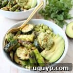The Green Vegan Buddha Bowl is filled with grilled veggies, green tahini sauce, avocado & quinoa for a healthy, filling meal that's also gluten free!