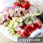 This gluten free Cajun Turkey Cobb Salad recipe is colorful, flavorful & so easy to make! It's topped with Cajun turkey, avocado, tomatoes & creamy Cajun ranch dressing!