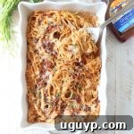 This creamy, dreamy Baked Spaghetti recipe is tossed in a cheesy, bbq sauce with shredded chicken & crispy bacon for a delicious meal made in under an hour!